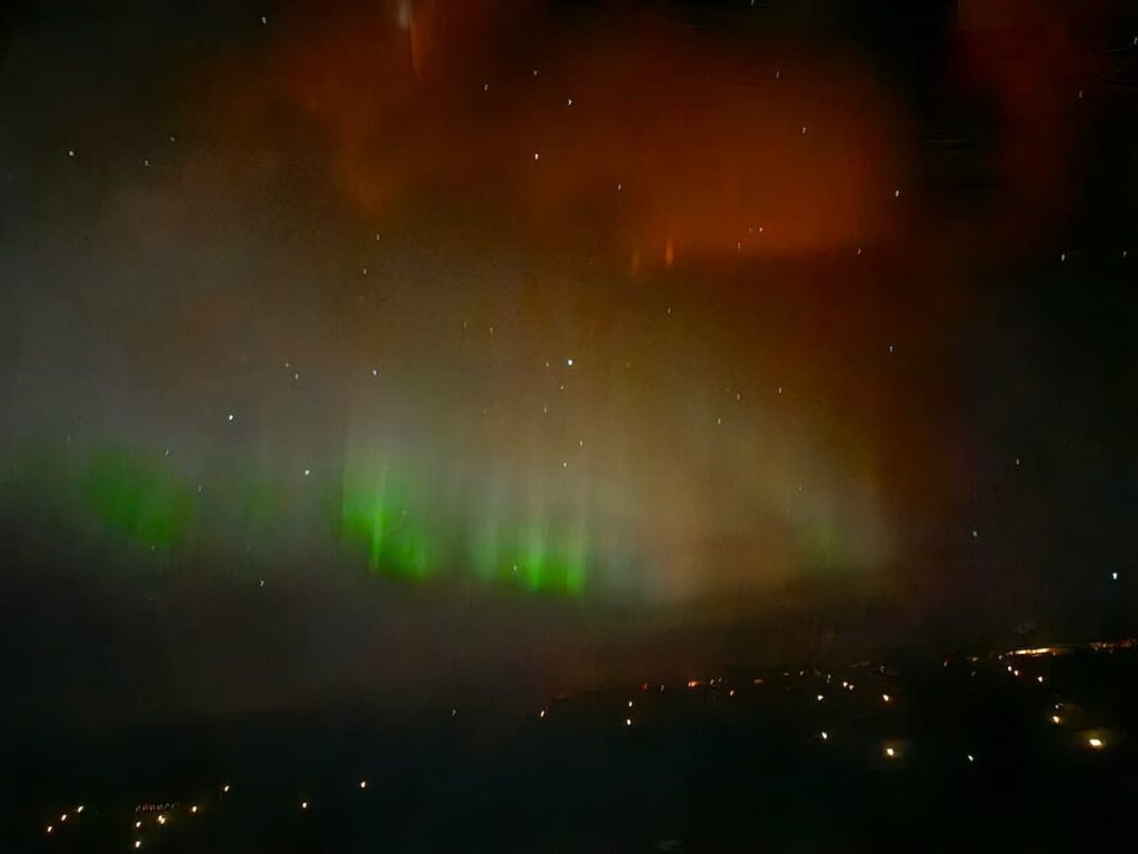 The northern lights, pale with touches of vivid green