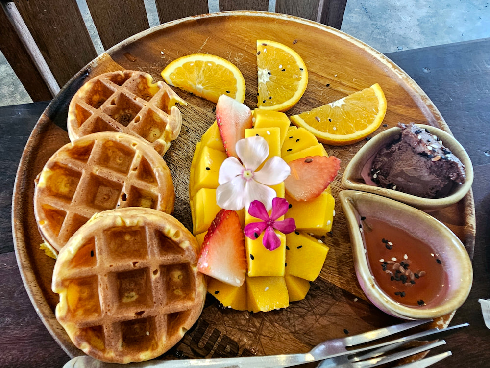 Vegan breakfast in Koh Samui, Thailand: Sweet potato waffles with mango and sauces at Pure Vegan Heaven