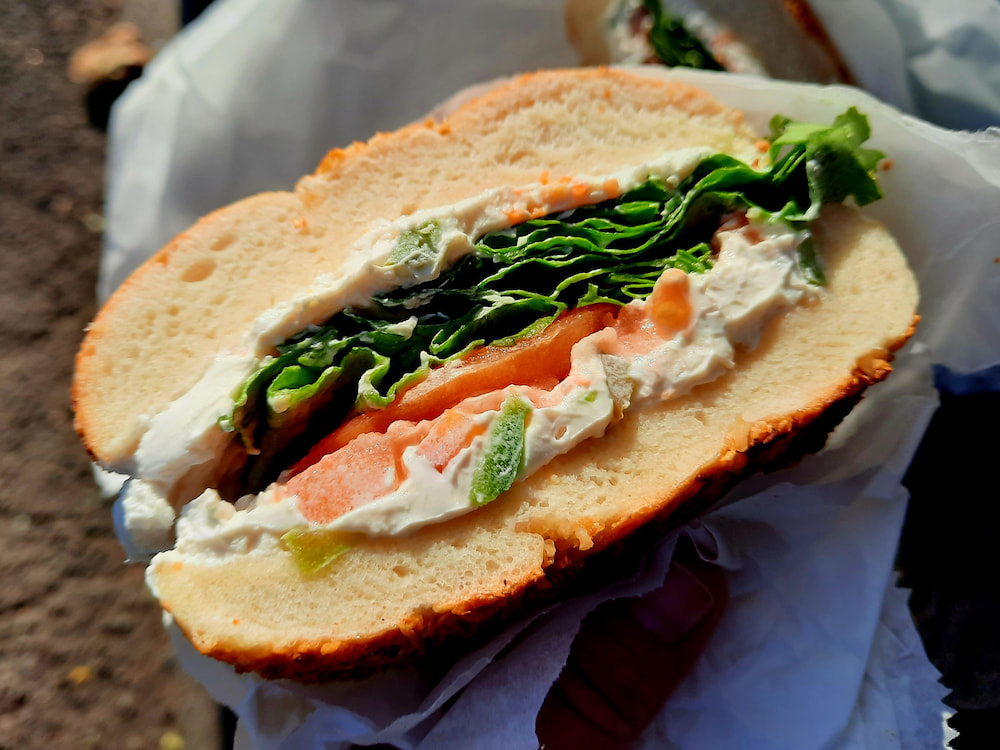 Vegan breakfast in NYC: Bagel sandwich from Tompkins Square Bagels, with tofu spread and veggies